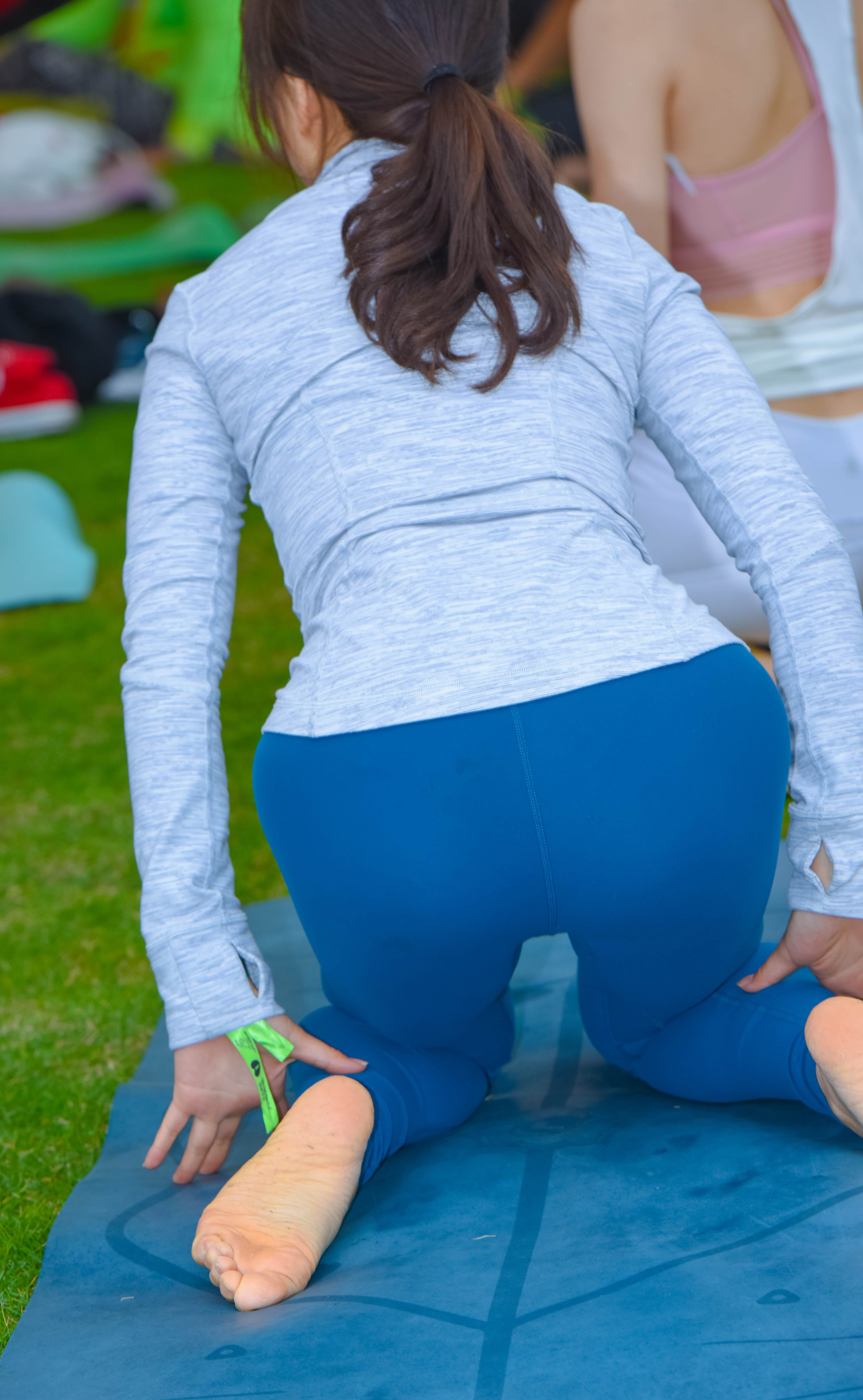asian feet on yoga mat